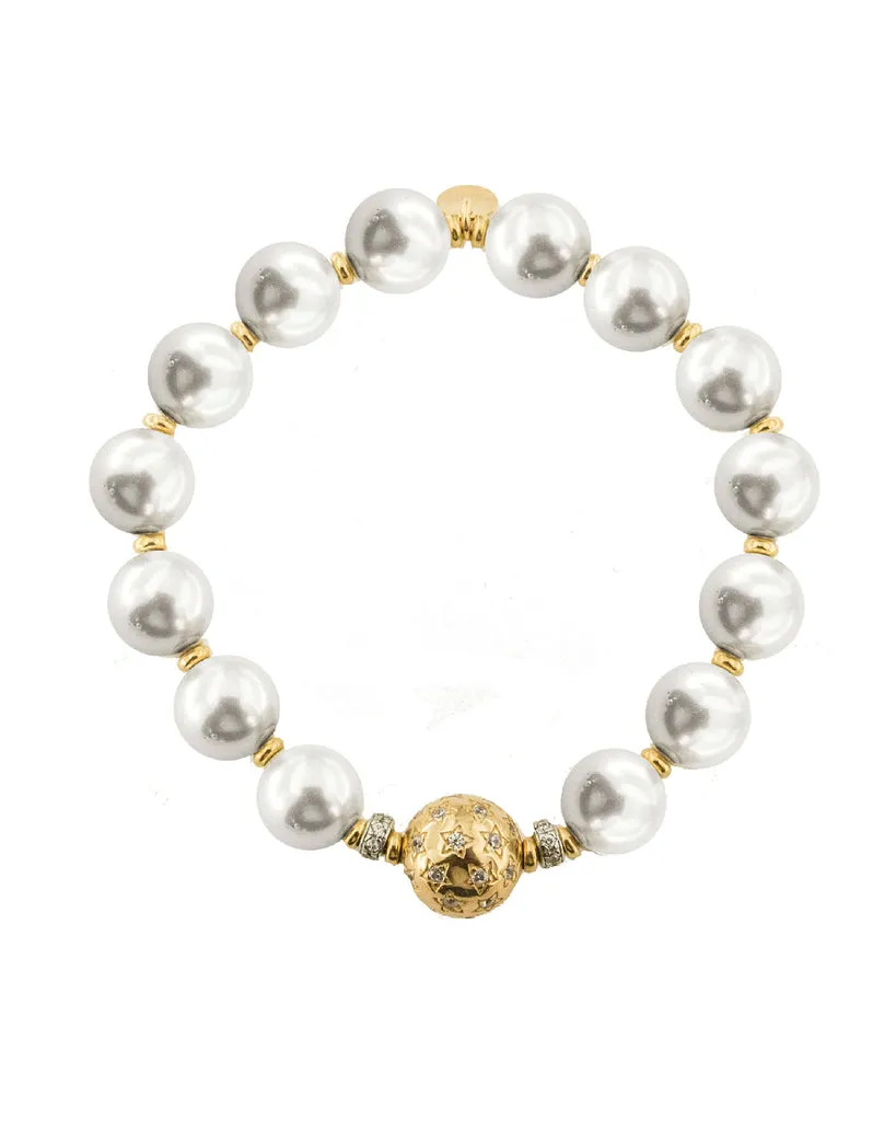 Bracciale elastico collezione "Starball" con perle e zirconi.